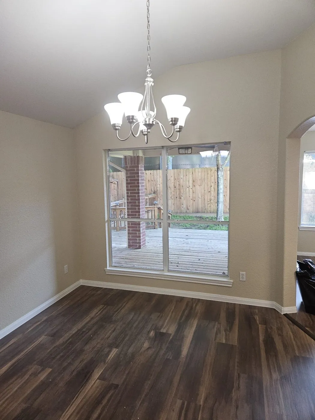 Freshly painted dining room with a new chandelier